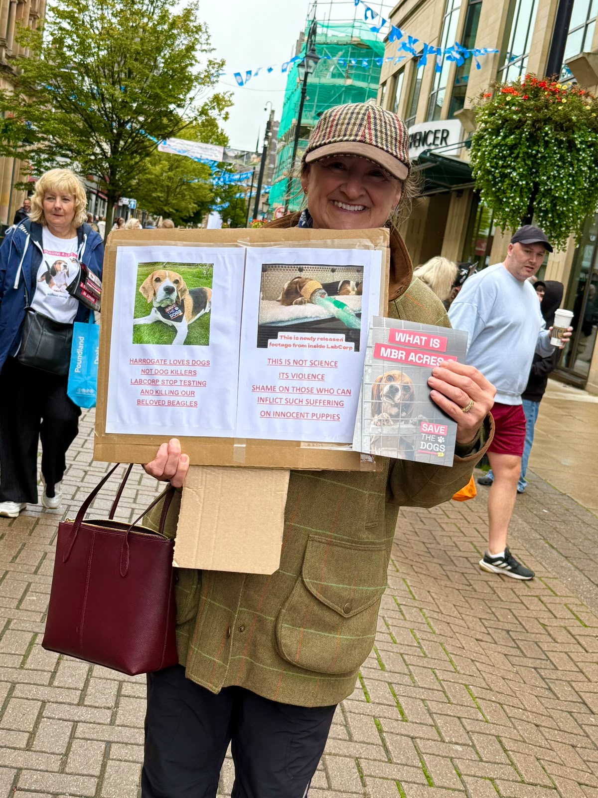 Lady holding leaflets and banners